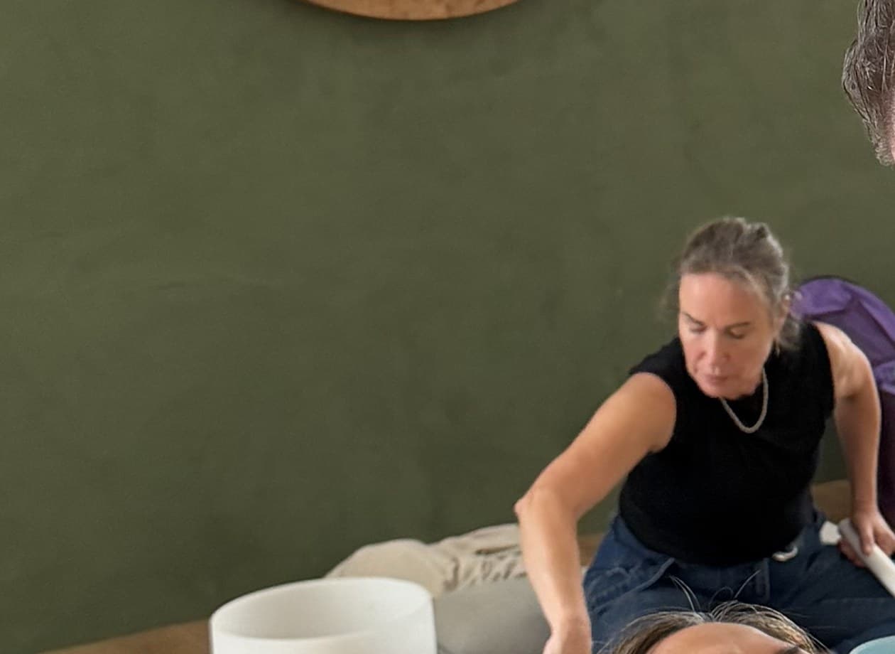 Renata Jack playing crystal singing bowls
